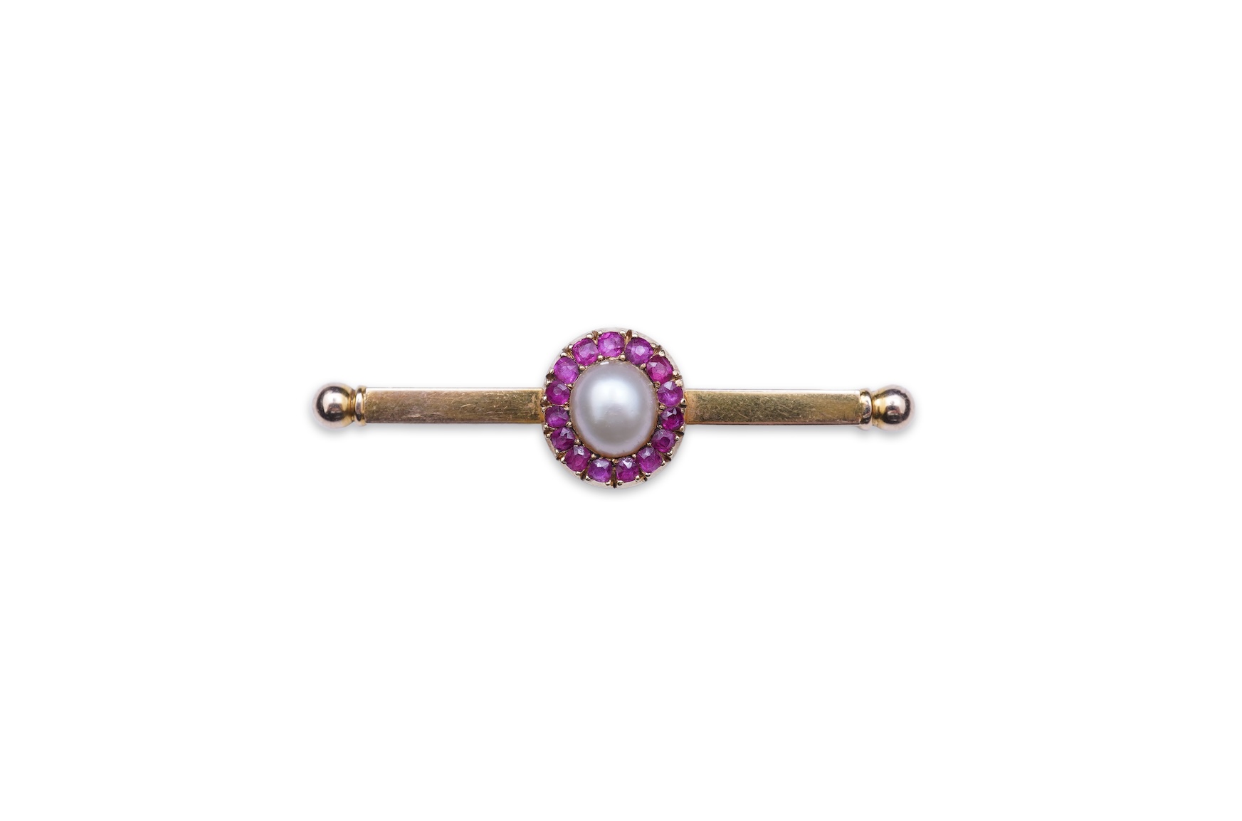 A pearl and ruby bar brooch, 19th century